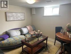 Recessed window providing natural light, light-toned walls, and a ceiling-mounted light fixture -
