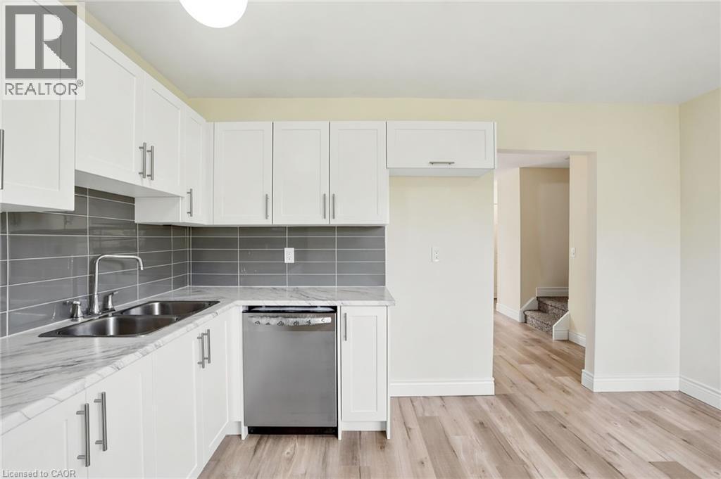 65 Mount Albion Road Unit# 4, Hamilton, ON - Indoor Photo Showing Kitchen With Double Sink