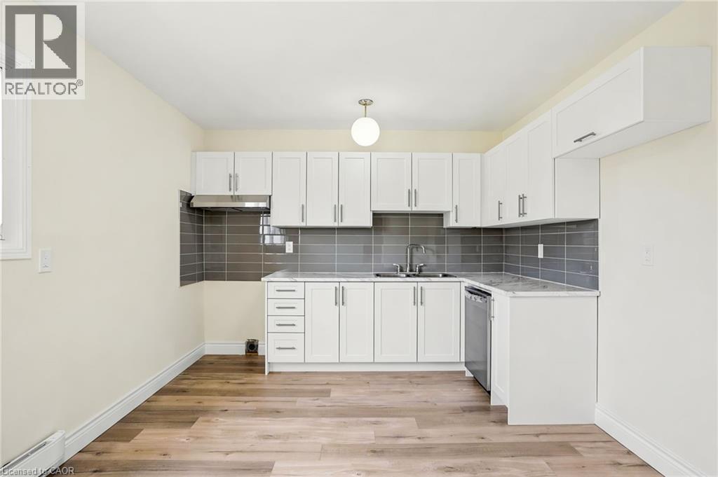 65 Mount Albion Road Unit# 4, Hamilton, ON - Indoor Photo Showing Kitchen With Double Sink