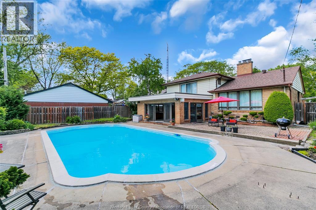 719 Champlain Drive, Windsor, ON - Outdoor With In Ground Pool