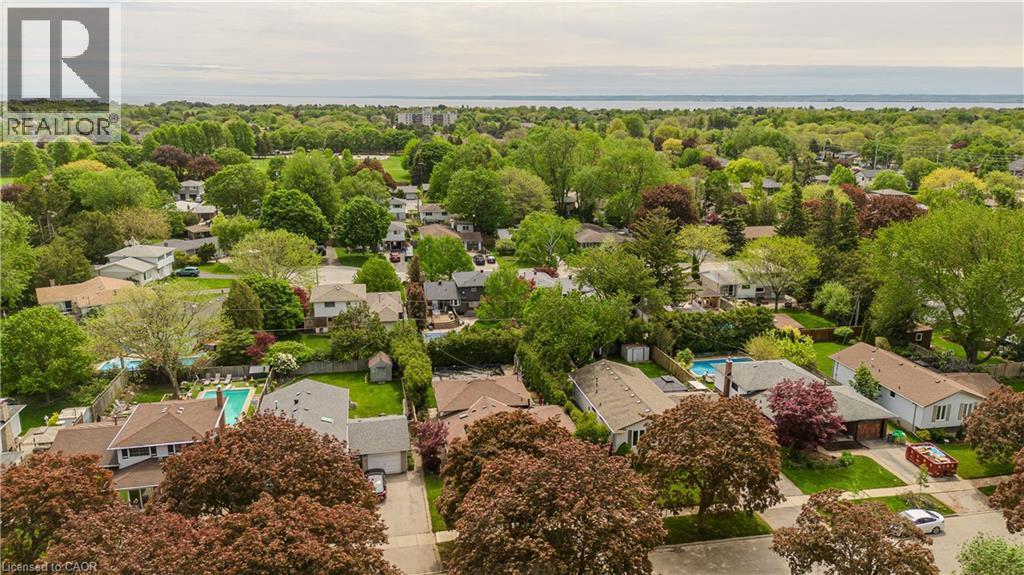 Aerial perspective showcasing a residential area with mature trees and a distant body of water - 643 Artreva Crescent, Burlington, ON - Outdoor With View