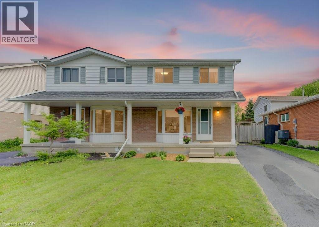 Two-story residence featuring light siding and brick accents - 603 Pinerow Crescent Unit# B, Waterloo, ON - Outdoor With Deck Patio Veranda With Facade