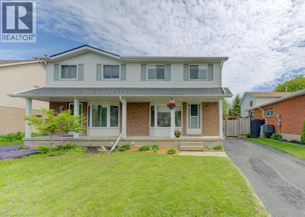 Two-story residence featuring light siding and brick exterior - 603 Pinerow Crescent Unit# B, Waterloo, ON - Outdoor With Deck Patio Veranda With Facade