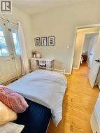 Hardwood flooring throughout this room and extending into the hallway -
