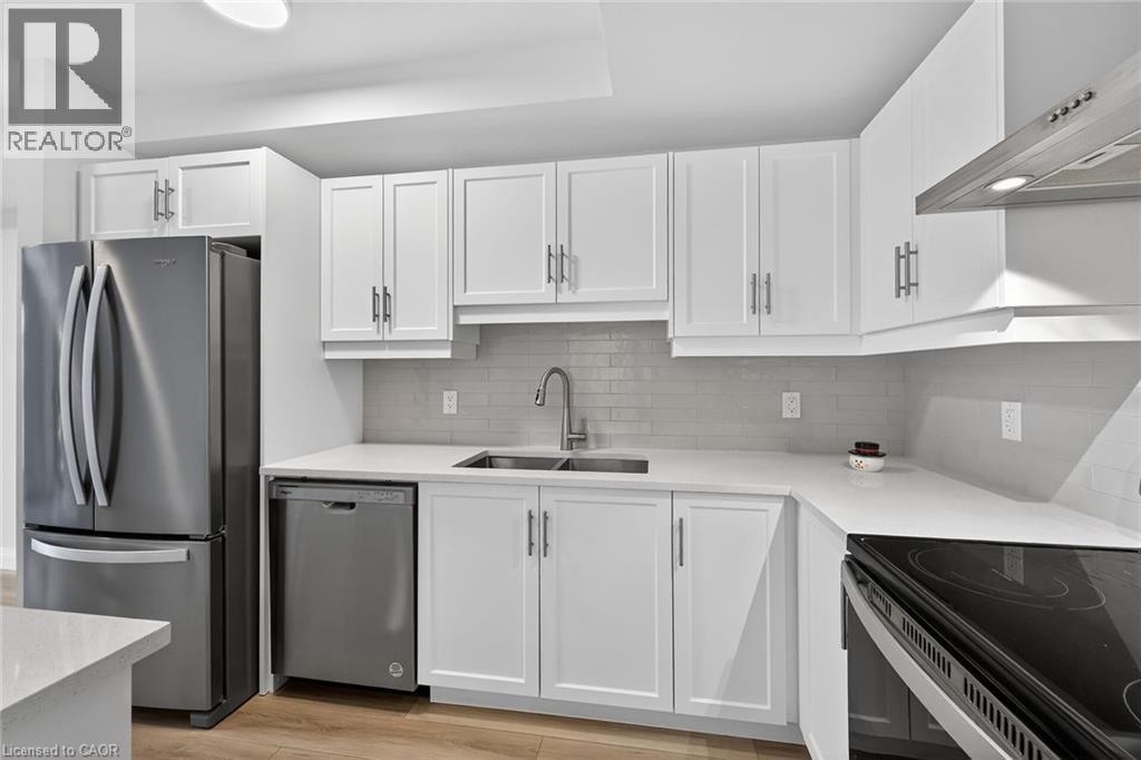 Quartz Counters - 153 Wilson Street W Unit# 310, Ancaster, ON - Indoor Photo Showing Kitchen With Stainless Steel Kitchen With Double Sink