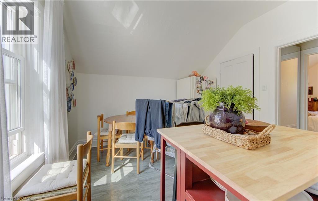 Upper unit kitchen in-area dining with sloped ceiling, and natural window light - 48 Breithaupt Street, Kitchener, ON - Indoor Photo Showing Dining Room