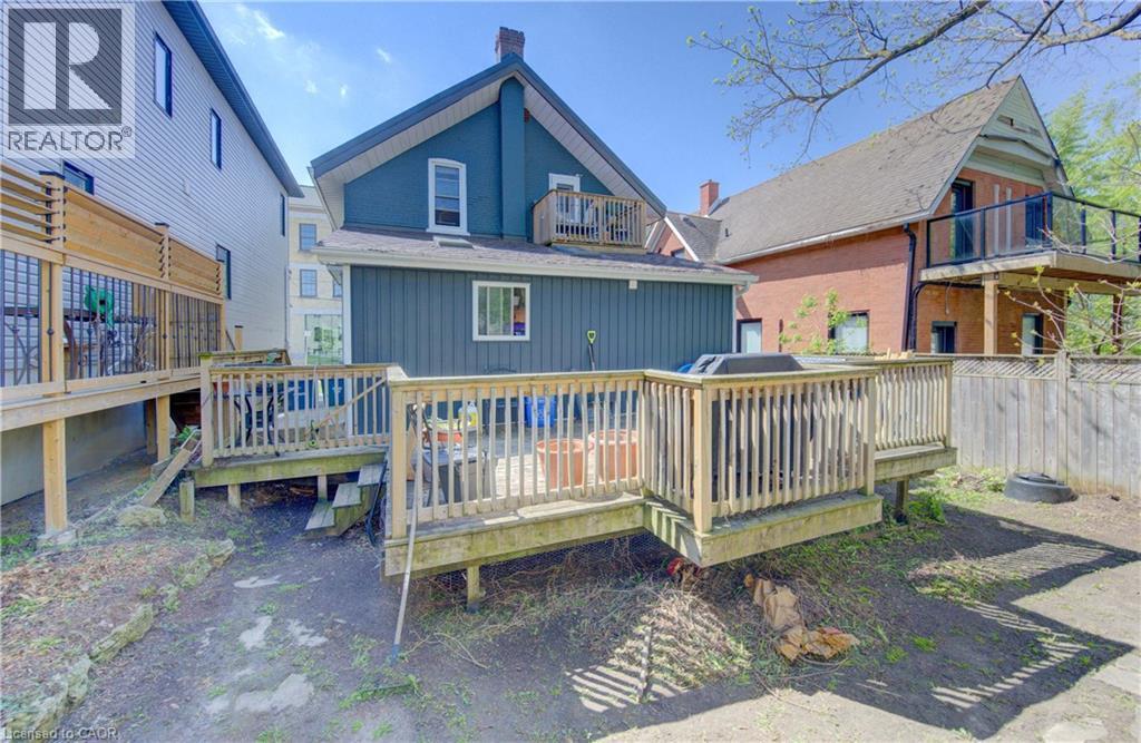 Expansive sun-filled wooden deck featuring natural wood railings - 48 Breithaupt Street, Kitchener, ON - Outdoor