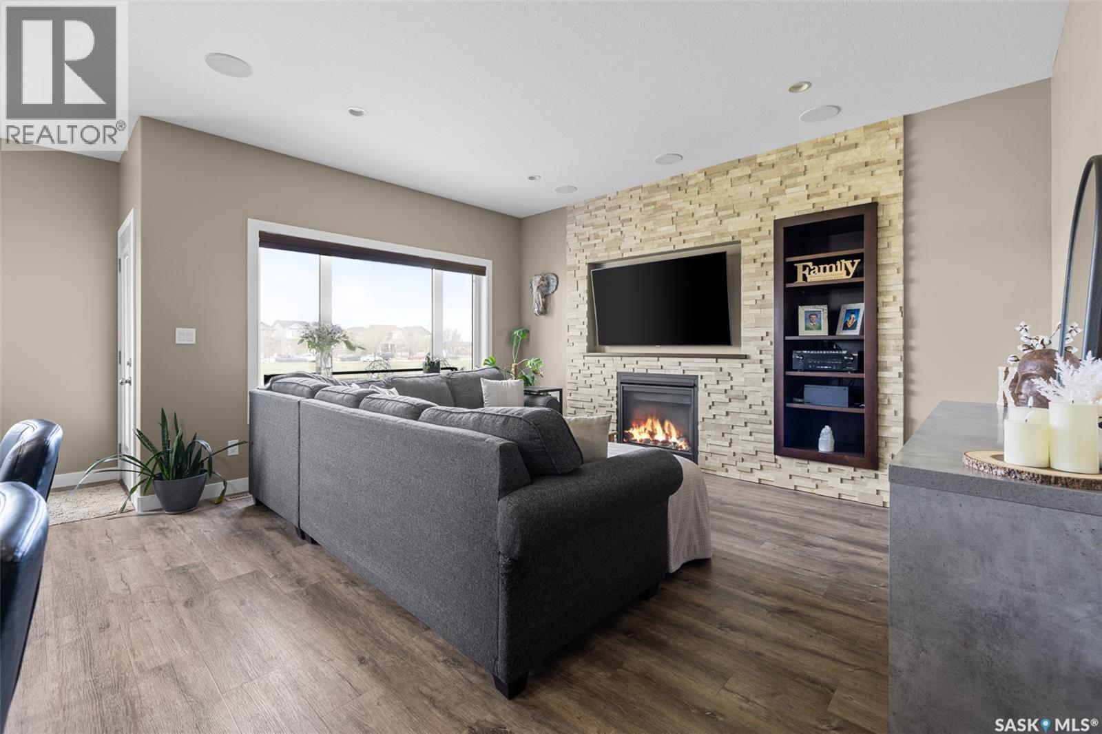5044 Crane Crescent, Regina, SK - Indoor Photo Showing Living Room With Fireplace