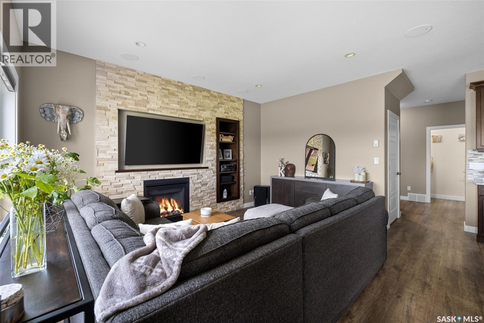 5044 Crane Crescent, Regina, SK - Indoor Photo Showing Living Room With Fireplace