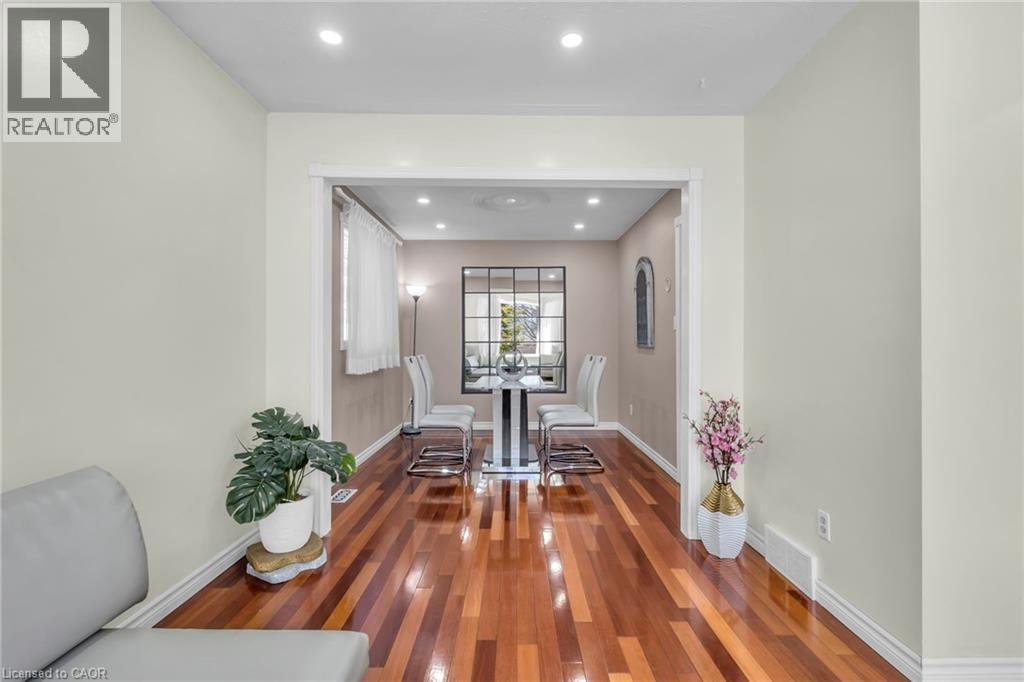 Dining room with recessed lighting and dark wood-type flooring - 146 Bechtel Drive, Kitchener, ON - Indoor