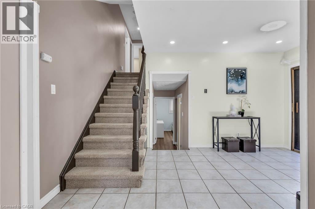 Staircase featuring recessed lighting and tile patterned floors - 146 Bechtel Drive, Kitchener, ON - Indoor Photo Showing Other Room