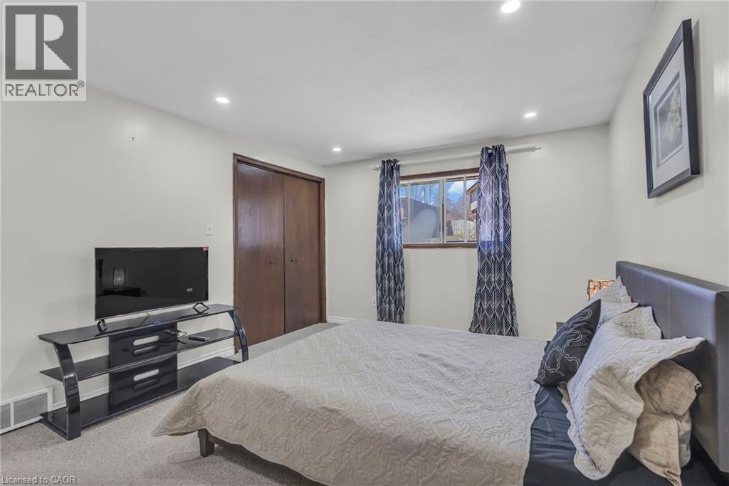 Bedroom featuring light carpet, a closet, and recessed lighting - 146 Bechtel Drive, Kitchener, ON - Indoor Photo Showing Bedroom