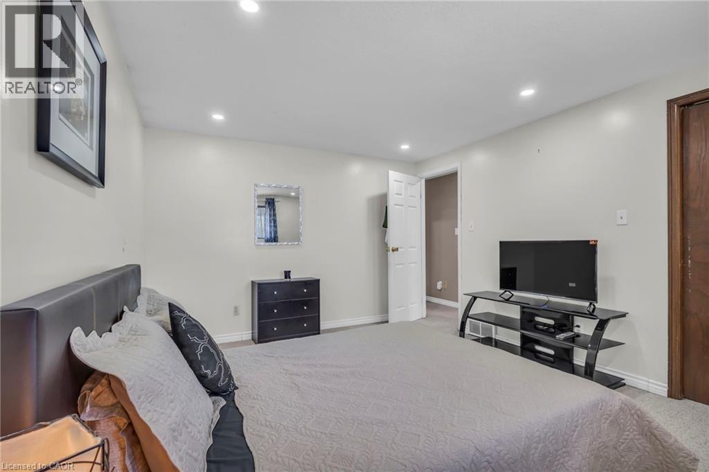 Bedroom with light colored carpet and recessed lighting - 146 Bechtel Drive, Kitchener, ON - Indoor
