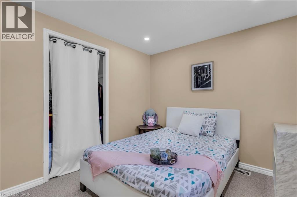 Bedroom with light colored carpet, recessed lighting, and a closet - 146 Bechtel Drive, Kitchener, ON - Indoor Photo Showing Bedroom
