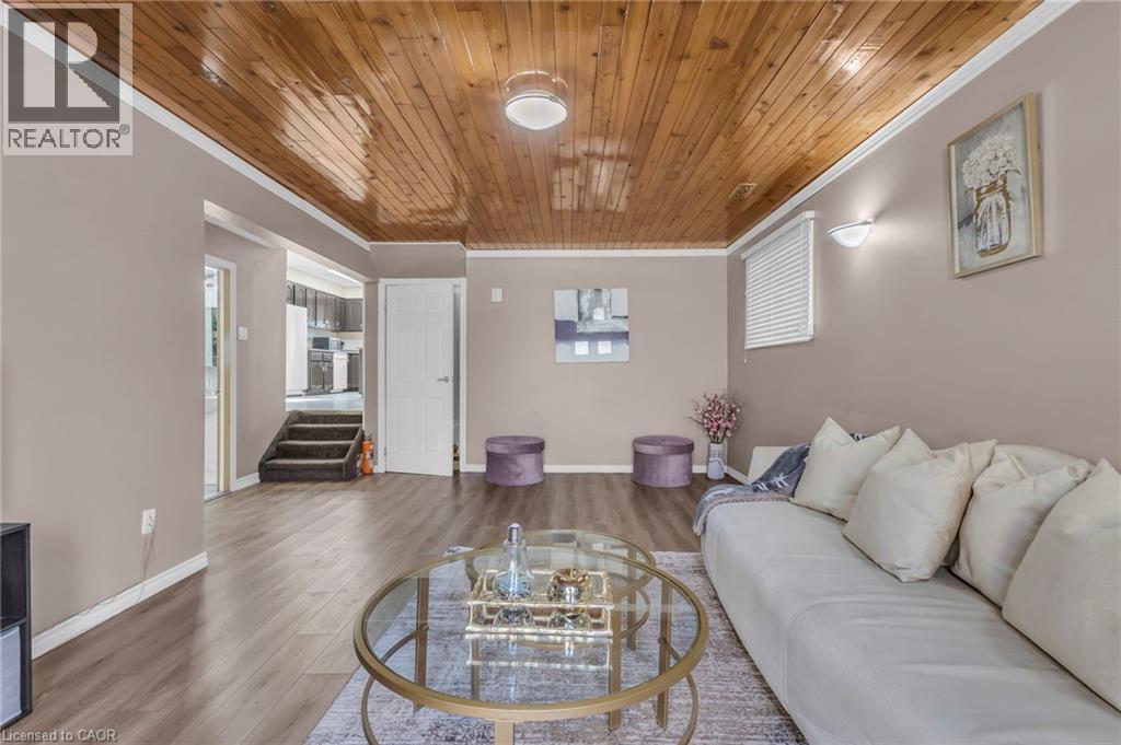 Living area featuring wood finished floors, wooden ceiling, and crown molding - 146 Bechtel Drive, Kitchener, ON - Indoor Photo Showing Living Room