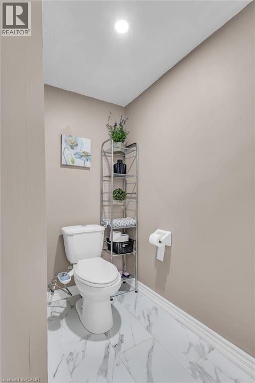 Bathroom featuring toilet and light marble finish flooring - 146 Bechtel Drive, Kitchener, ON - Indoor Photo Showing Bathroom