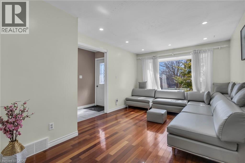 Living room featuring wood-type flooring and recessed lighting - 146 Bechtel Drive, Kitchener, ON - Indoor Photo Showing Living Room