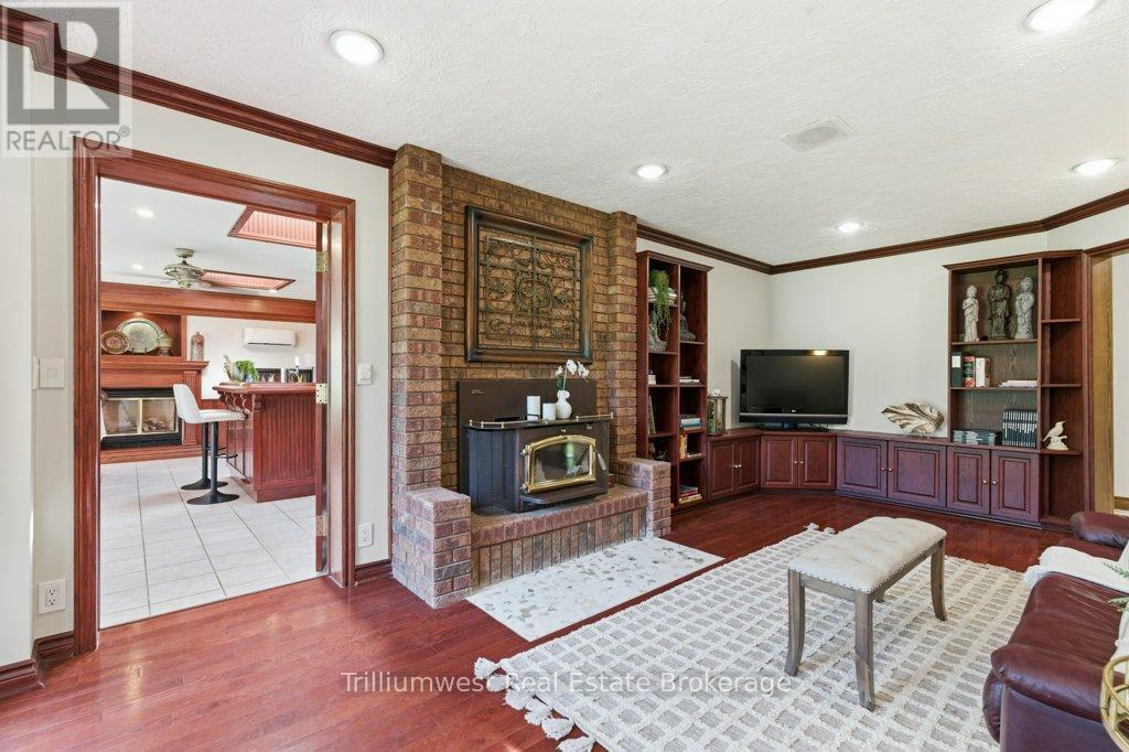 32 Sunset Drive, Woolwich, ON - Indoor Photo Showing Living Room With Fireplace
