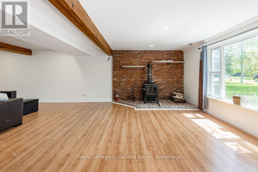 38 Foliage Drive, Tiny, ON - Indoor Photo Showing Living Room With Fireplace