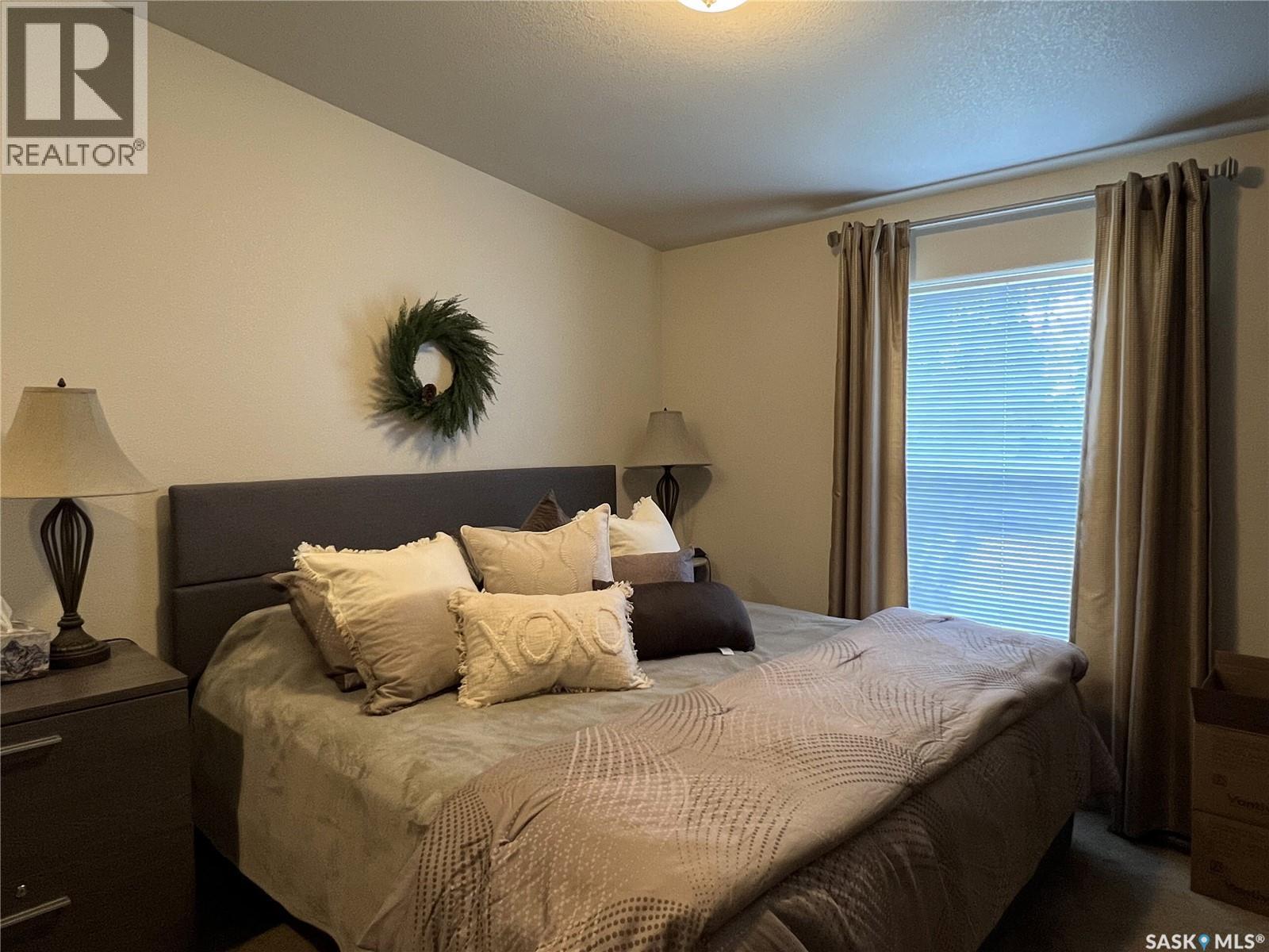208 2Nd Avenue Se, Dorintosh, SK - Indoor Photo Showing Bedroom