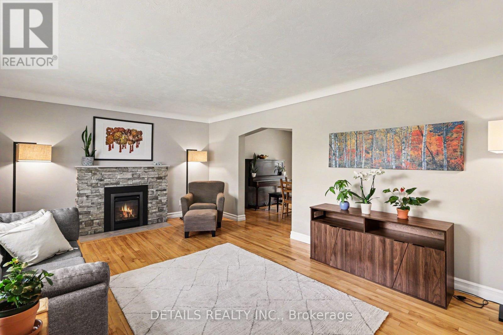 805 Smyth Road, Ottawa, ON - Indoor Photo Showing Living Room With Fireplace