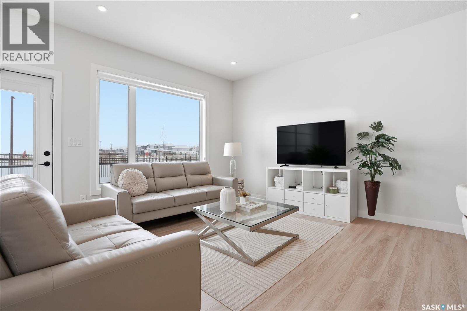 20 515 Delainey Road, Saskatoon, SK - Indoor Photo Showing Living Room