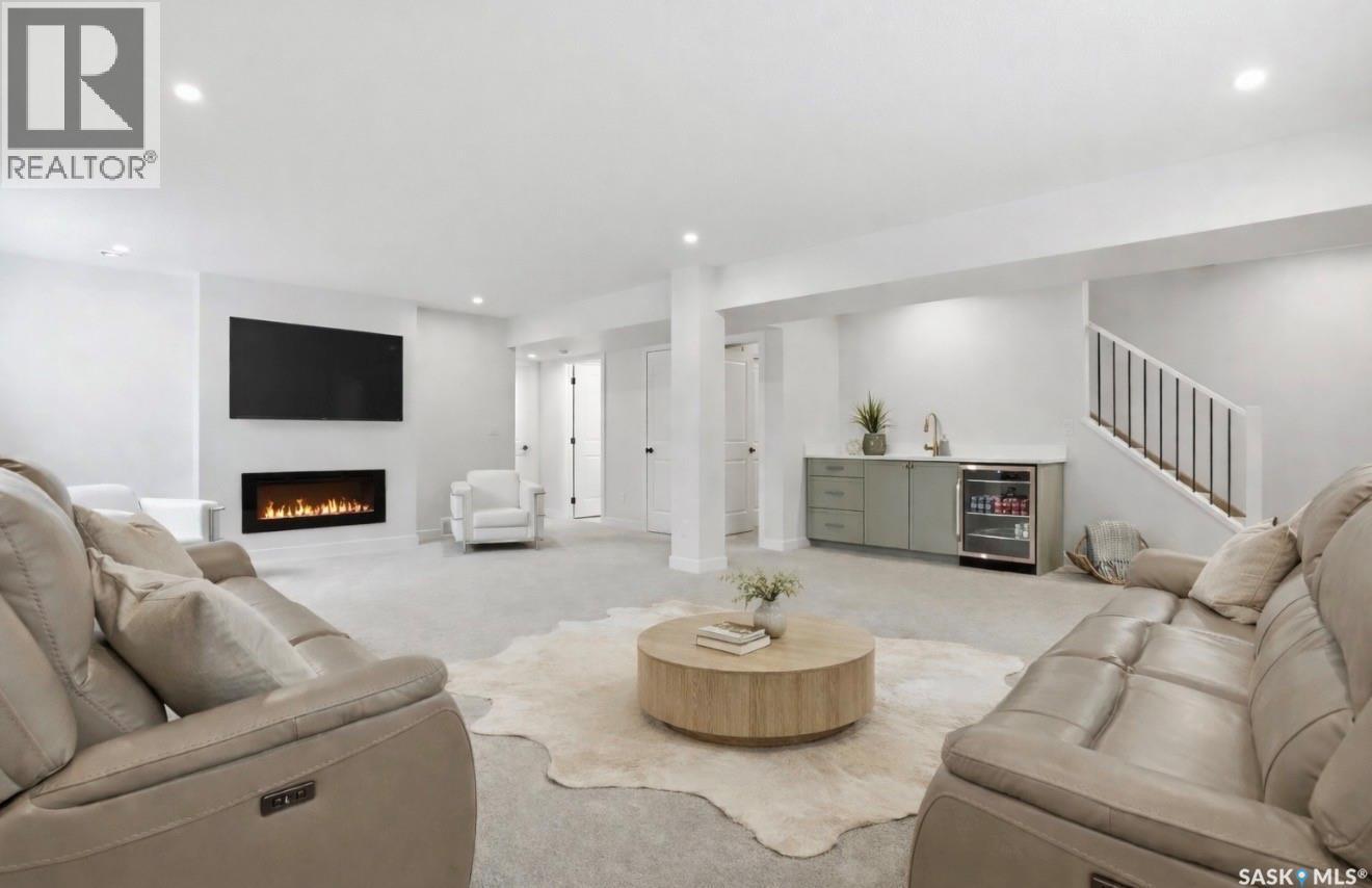 20 515 Delainey Road, Saskatoon, SK - Indoor Photo Showing Living Room With Fireplace