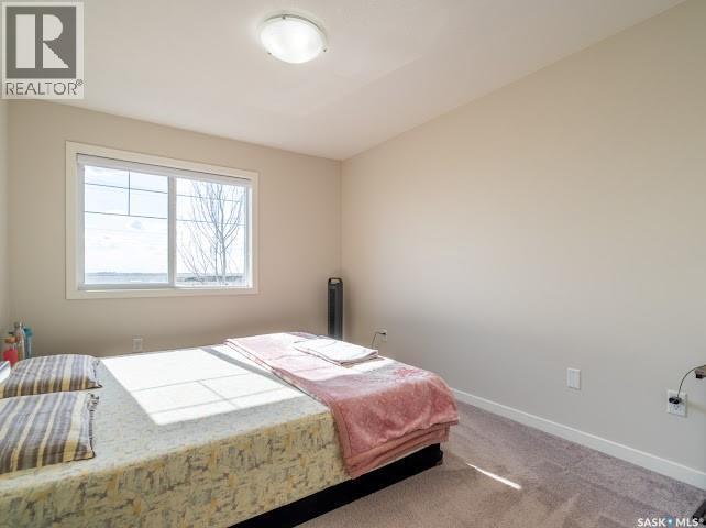 9 5752 Gordon Road, Regina, SK - Indoor Photo Showing Bedroom