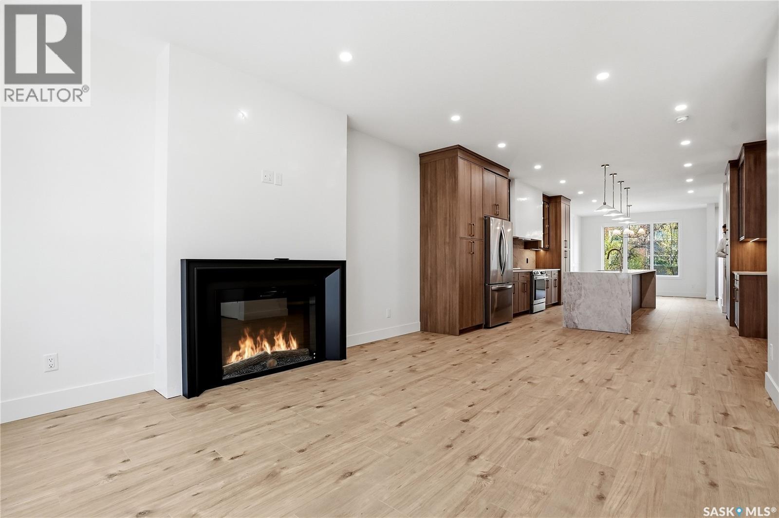 317 11Th Street, Saskatoon, SK - Indoor Photo Showing Other Room With Fireplace