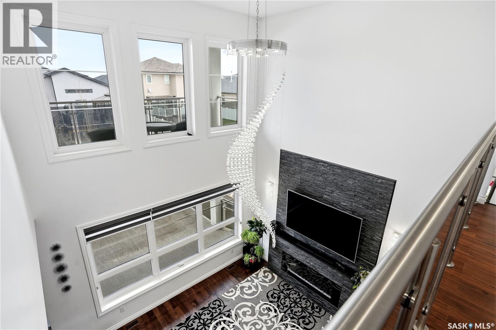 4714 E Green Apple Drive, Regina, SK - Indoor With Fireplace