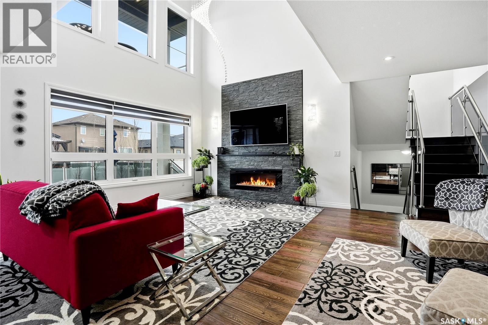 4714 E Green Apple Drive, Regina, SK - Indoor Photo Showing Living Room With Fireplace