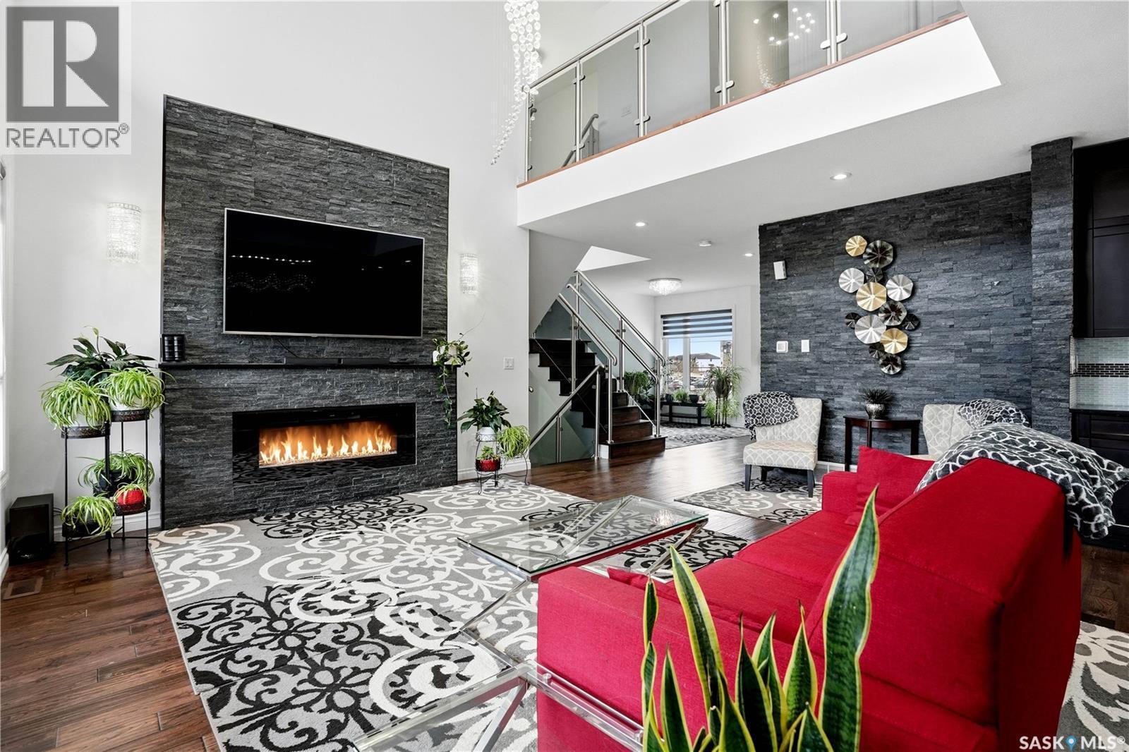 4714 E Green Apple Drive, Regina, SK - Indoor Photo Showing Living Room With Fireplace