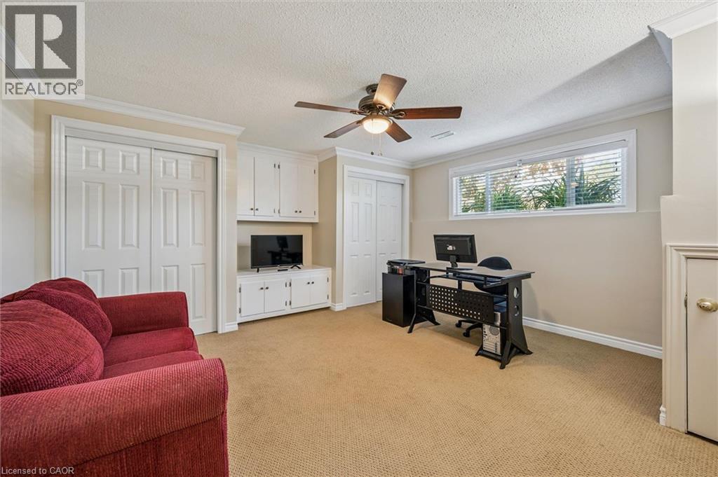 Carpeted room with crown molding and ceiling fan - 47 Oakhurst Crescent, Kitchener, ON - Indoor