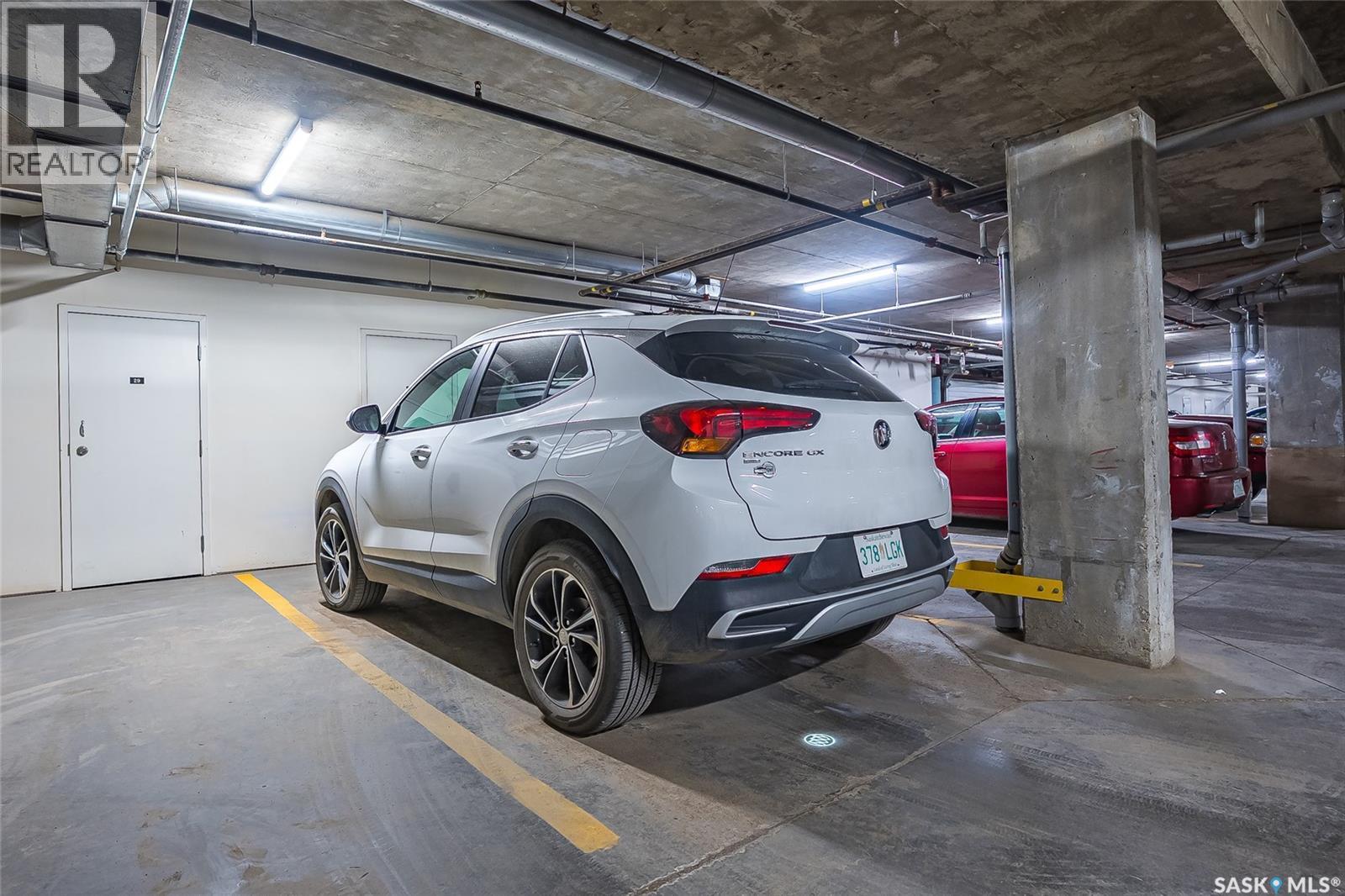 215 2213 Adelaide Street E, Saskatoon, SK - Indoor Photo Showing Garage