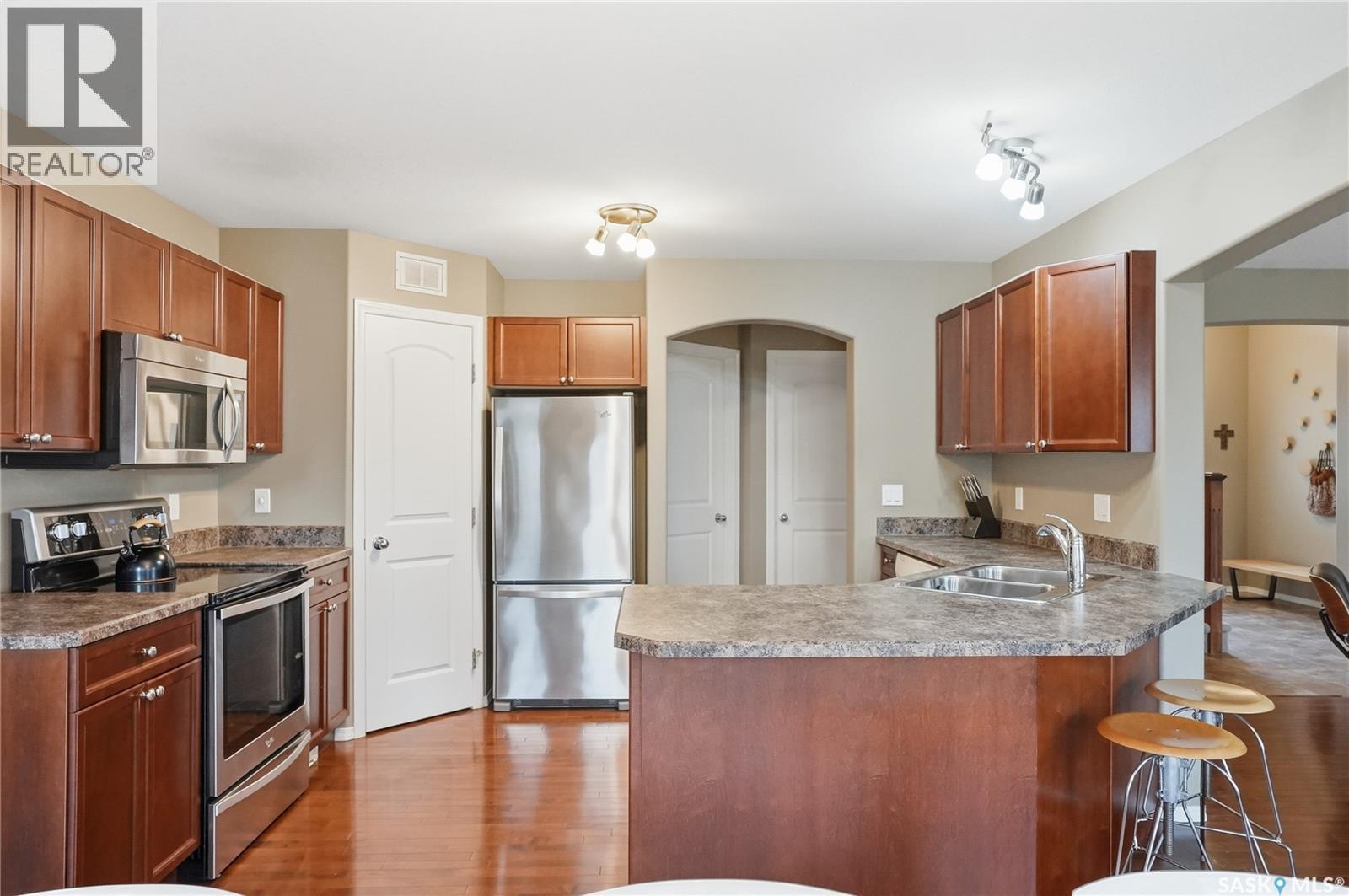 238 Stepney Crescent, Saskatoon, SK - Indoor Photo Showing Kitchen With Stainless Steel Kitchen With Double Sink