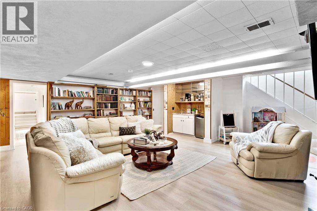 Finished lower level featuring wood-finish flooring - 91 Limerick Drive, Kitchener, ON - Indoor Photo Showing Living Room