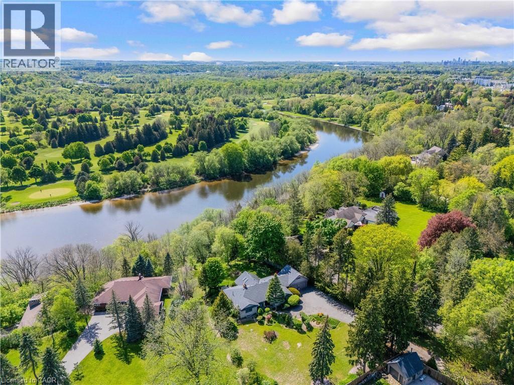 Expansive natural landscape featuring a river, mature trees, and a golf course - 91 Limerick Drive, Kitchener, ON - Outdoor With Body Of Water With View