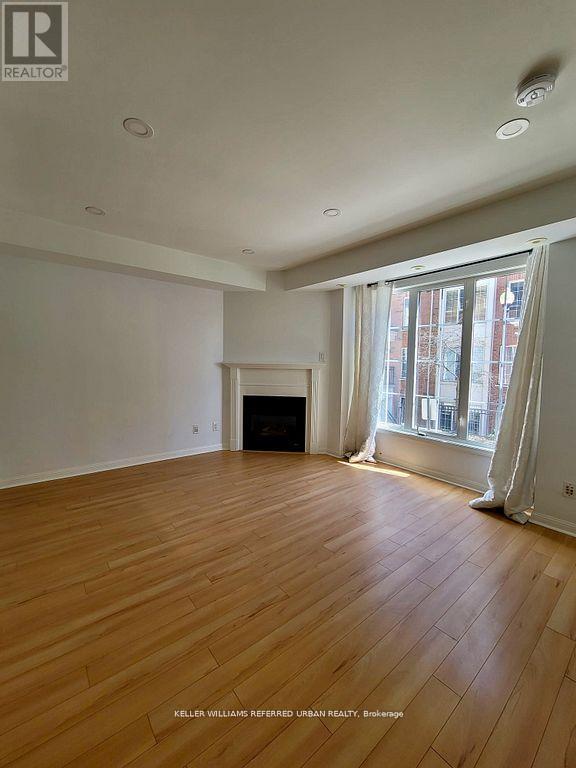 344 - 3 Everson Drive, Toronto, ON - Indoor Photo Showing Other Room With Fireplace