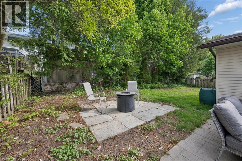 Backyard featuring a paver patio area and mature trees - 50 Lewis Crescent, Kitchener, ON - Outdoor