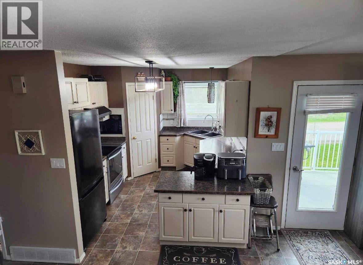 228 6Th Avenue N, Big River, SK - Indoor Photo Showing Kitchen With Double Sink