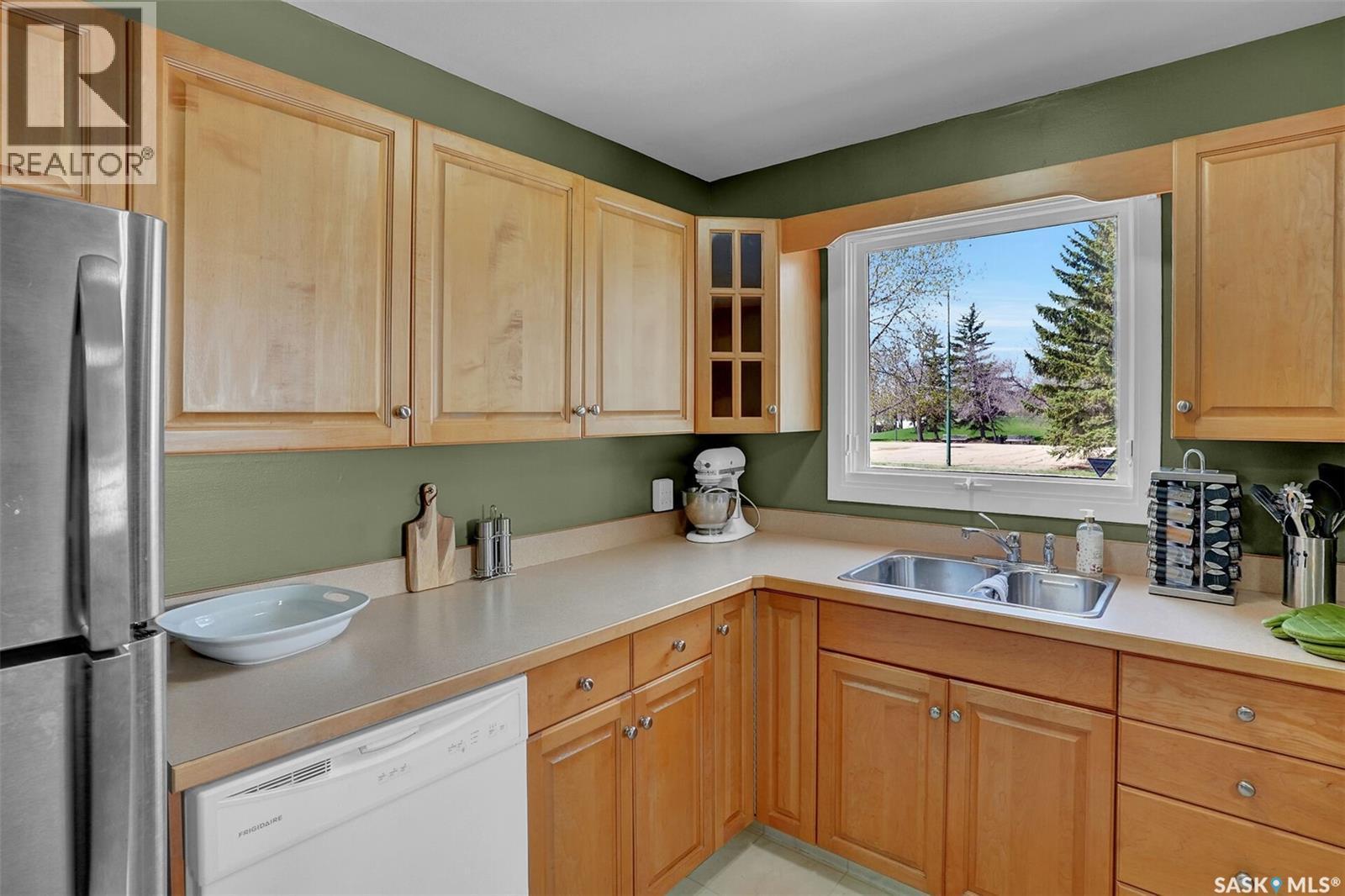 23 Hind Street, Regina, SK - Indoor Photo Showing Kitchen With Double Sink