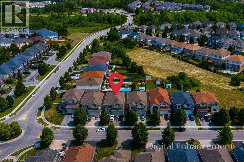 Aerial perspective showcasing a residential community with varied architectural styles - 197 Cloverleaf Drive, Ancaster, ON - Outdoor With View