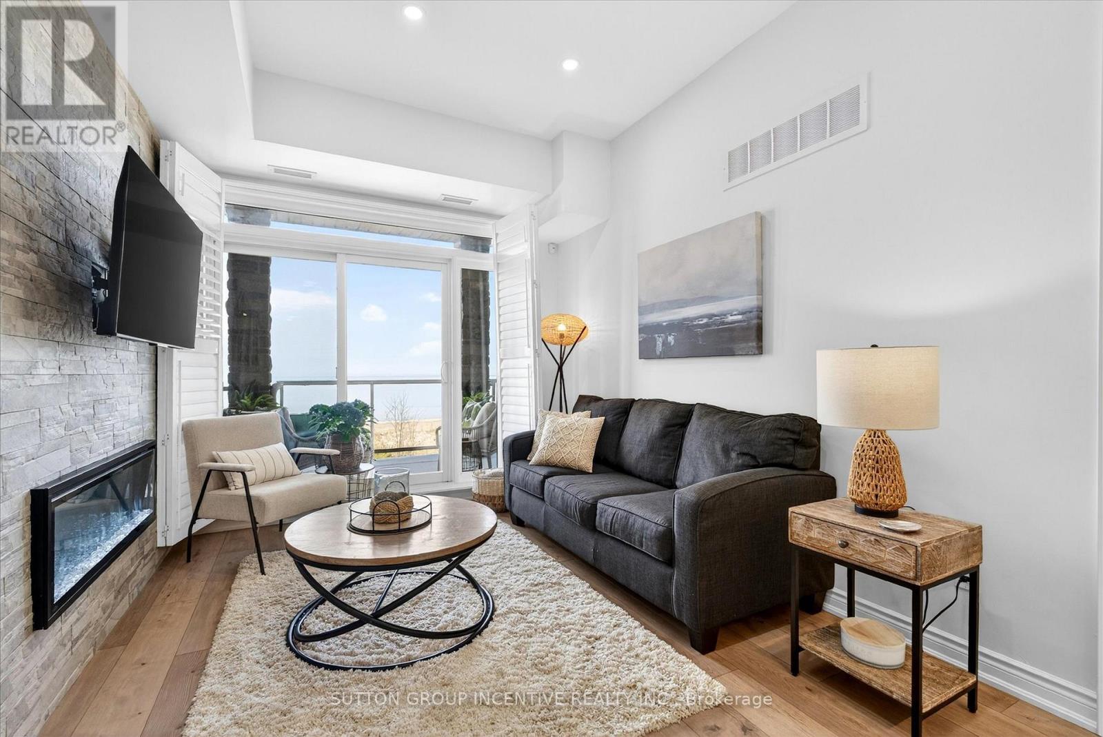 209 - 764 River Road E, Wasaga Beach, ON - Indoor Photo Showing Living Room With Fireplace