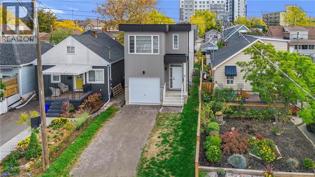 Contemporary two-story exterior with a flat roofline and gray siding - 37 Delena Avenue S, Hamilton, ON - Outdoor With Facade