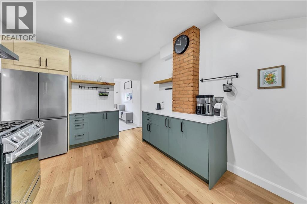 Kitchen featuring wood-finish flooring, recessed lighting, and white walls - 501 Ferguson Avenue N, Hamilton, ON - Indoor Photo Showing Kitchen