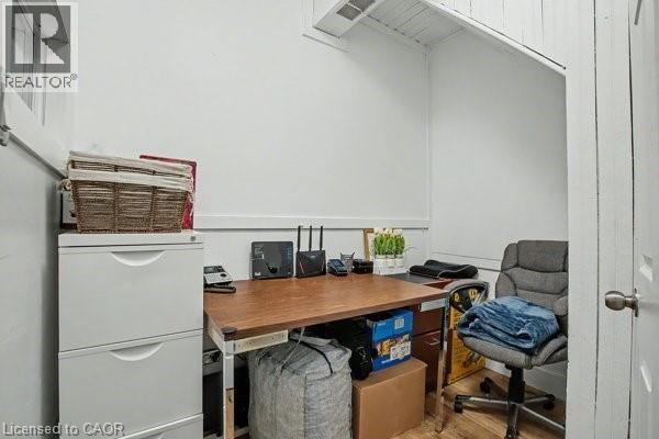 Compact space featuring white painted walls and wood-finish flooring - 37 Wellington Street, Cambridge, ON