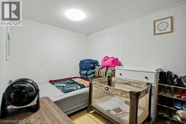 White paneled walls with a ceiling-mounted light fixture - 37 Wellington Street, Cambridge, ON
