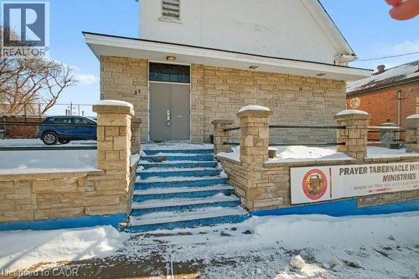 Stone-clad exterior with a prominent entrance featuring wide steps - 37 Wellington Street, Cambridge, ON