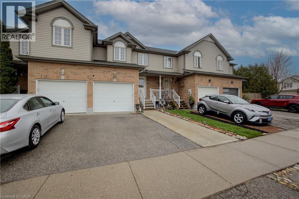 Brick and siding exterior with arched windows - 53 Prosperity Drive, Kitchener, ON - Outdoor With Facade