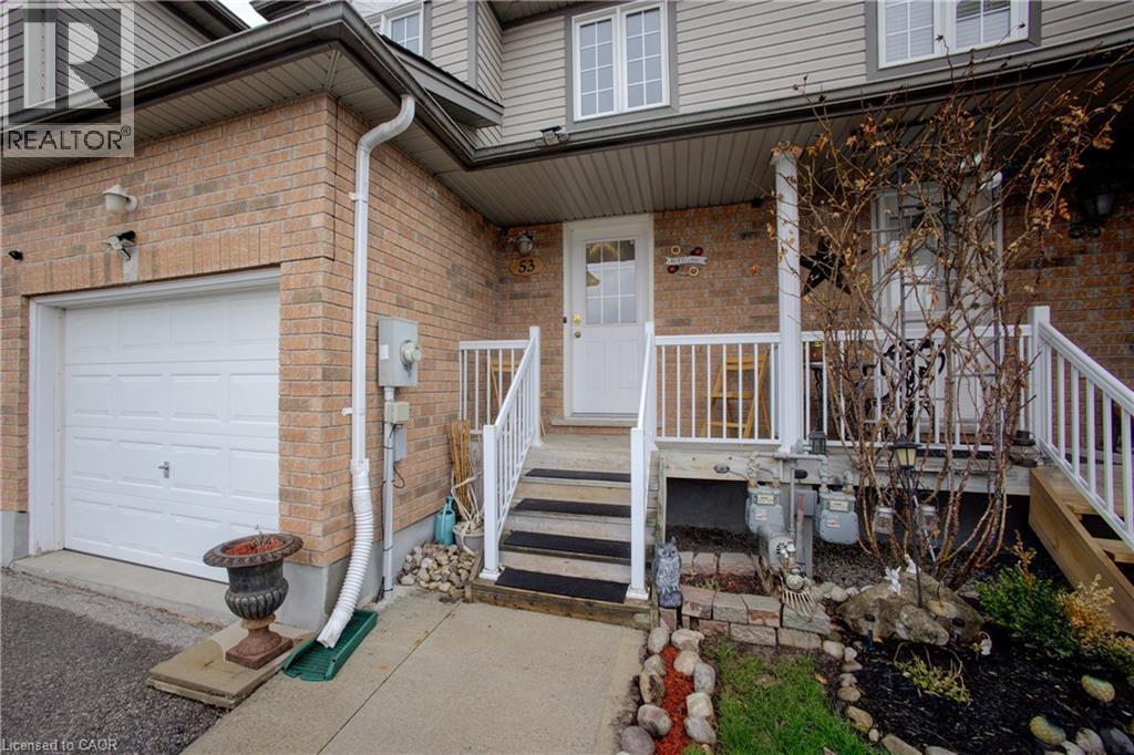 Brick exterior with siding accents and white-framed windows - 53 Prosperity Drive, Kitchener, ON - Outdoor With Exterior